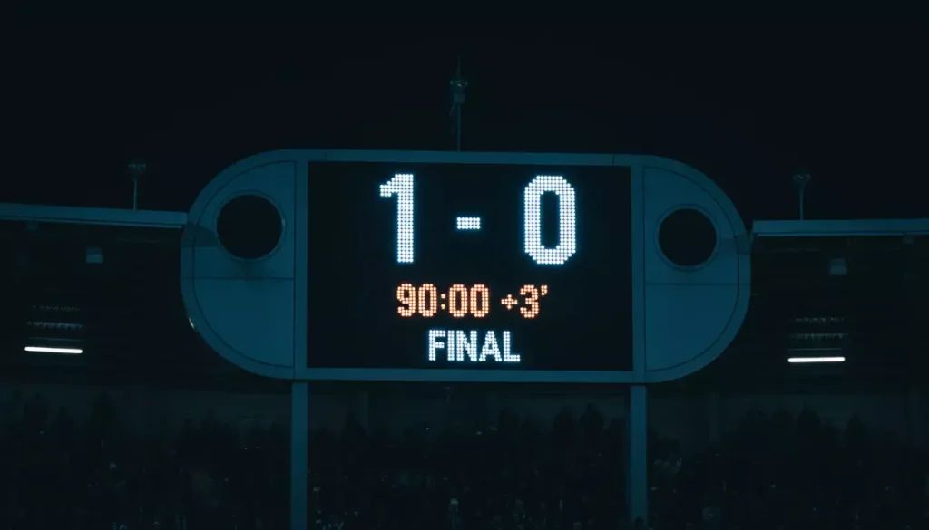 Scommesse risultato esatto: tabellone luminoso dello stadio che mostra il punteggio di una partita